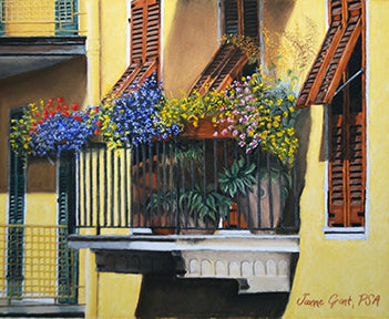 Italian balcony is a pastel painting by joanne grant.  It is a close up of a balcony with summer flowers atop the balcony fence.  The flowers are blue, yellow, pink and red.  The building is yellow with brown color shutters.